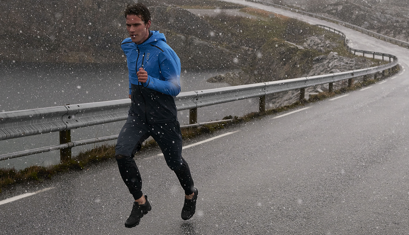 A person running through rainy New York in GTX shoes