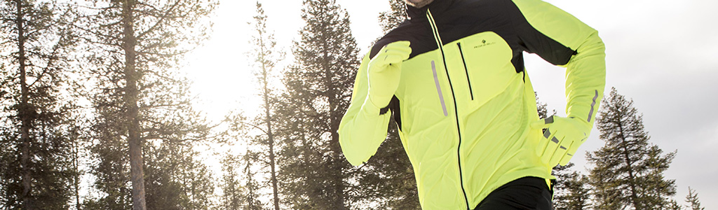 A man on a run in a hi vis jacket 