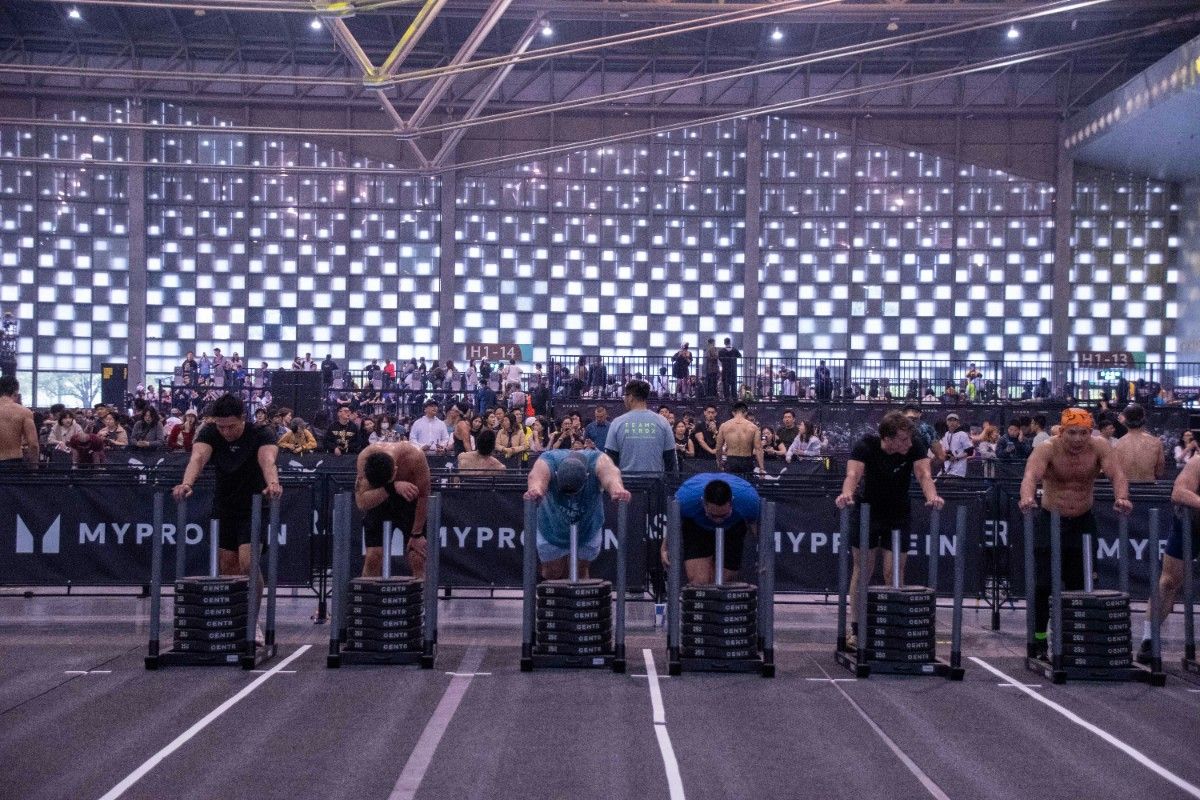 An image of people pushing a sled in Hyrox