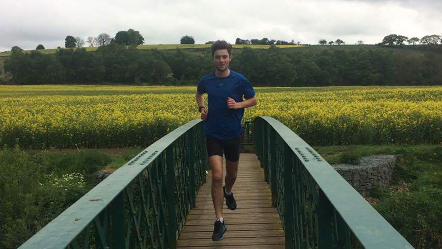 A man running, passing on a bridge