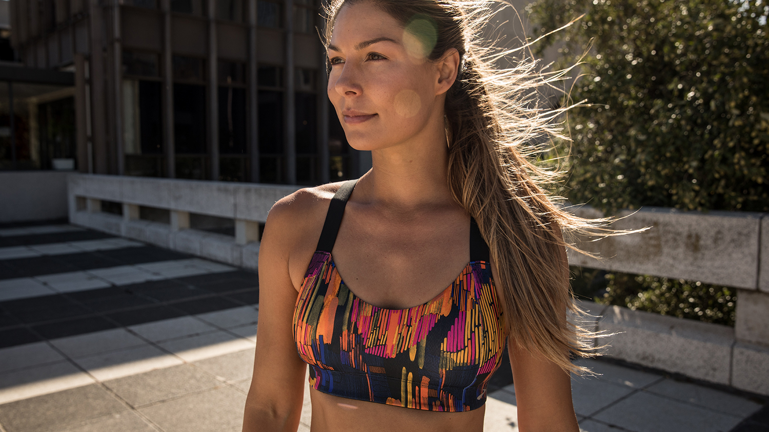 A woman in a Brooks sports bra 