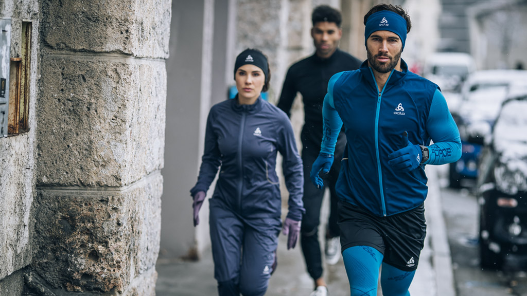 Group of people running in the street