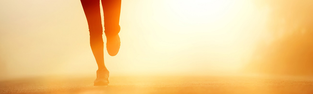 A person on a run in the sunset