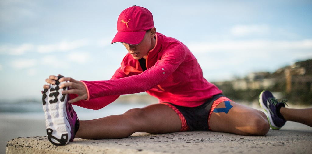 A woman stretching after her run 