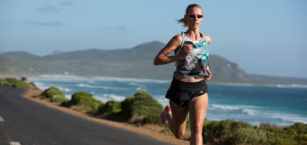 A person running by the coast 