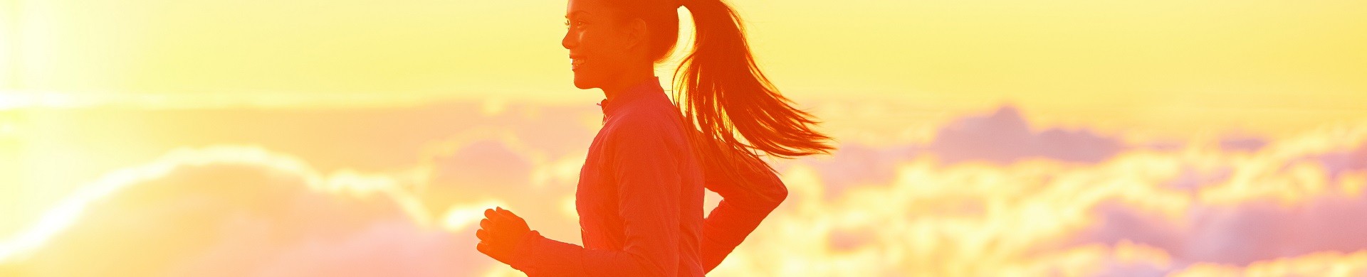 A person on a run at sunset 