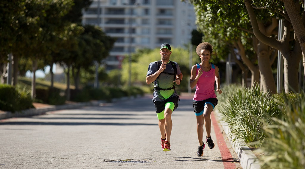 Two run commuters on their way to work 