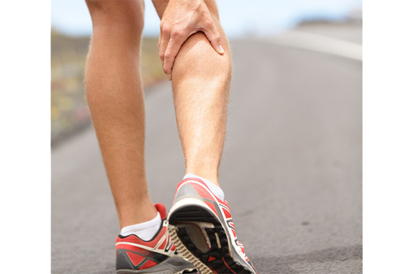 A person nursing their leg injury
