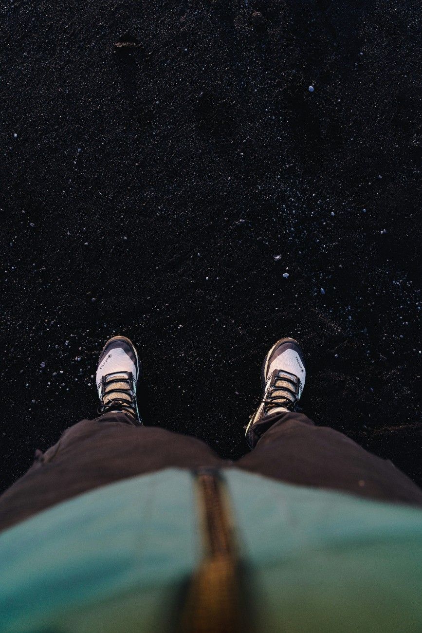 A person taking a photo of their gtx shoes