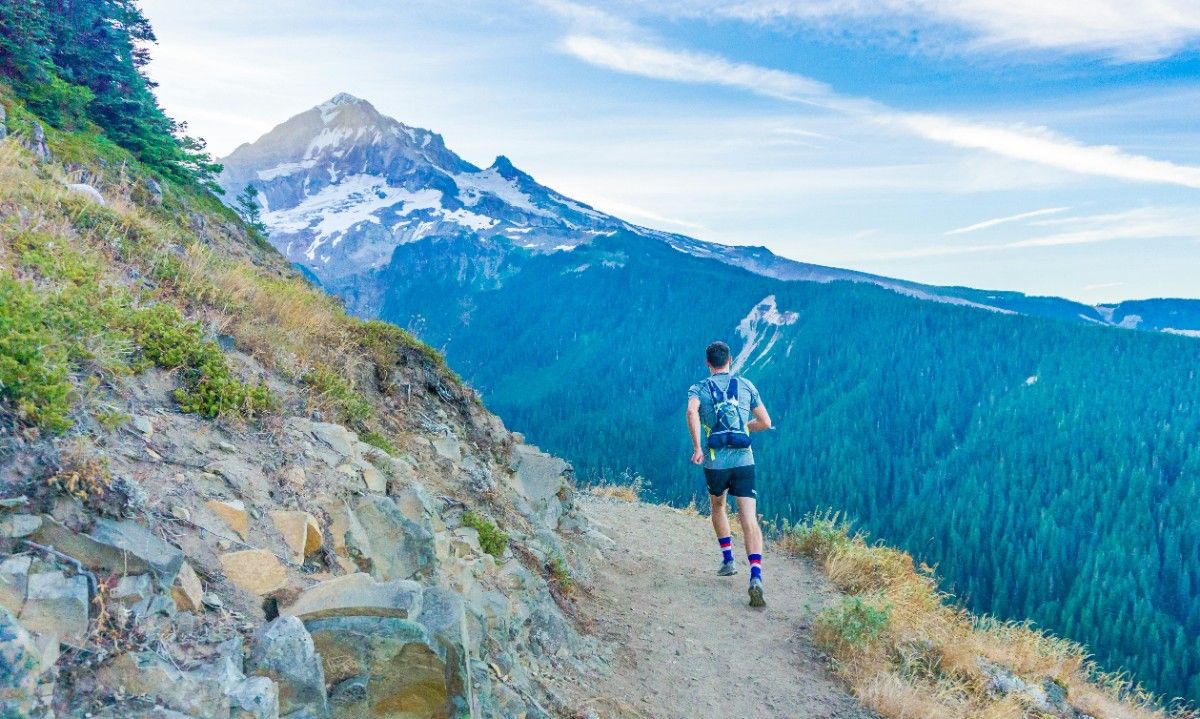 A person trail running in Goretex shoes