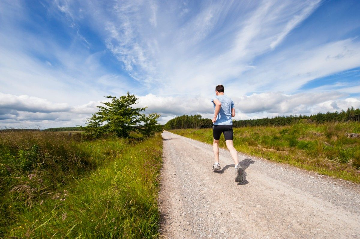A person trail running in their GTX running shoes 