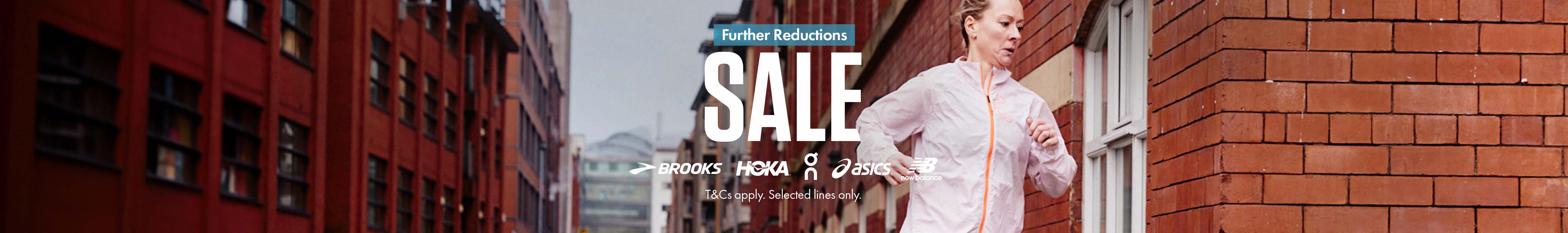 Shop Further Reductions Sale. A woman is jogging in the street