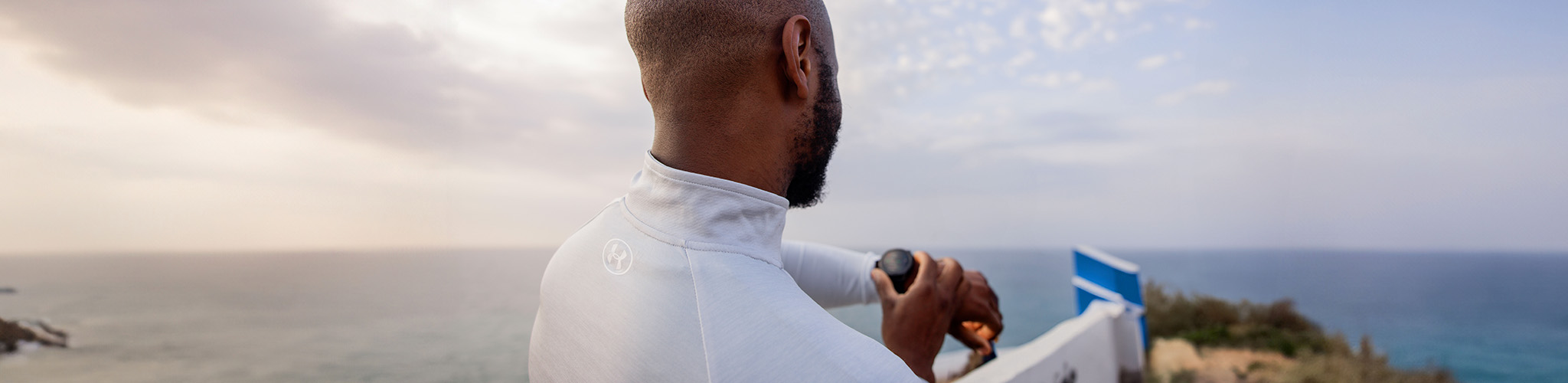 Shop Electronics new season. A person looking at the wrist watch