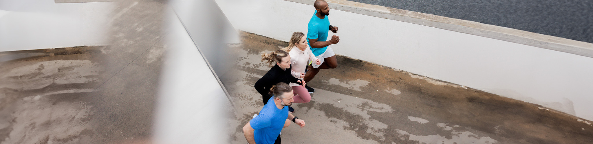 Shop race esentials new season. A group of runners running on the street