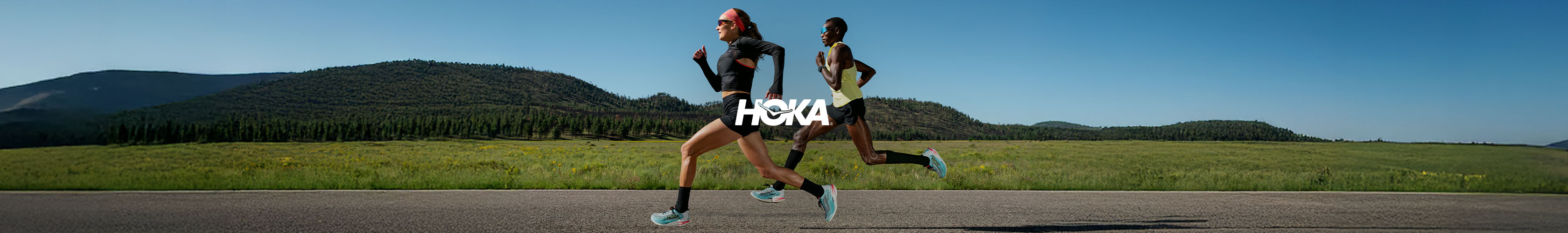 Hoka brand page. A pair of runners in Hoka clothing and shoes