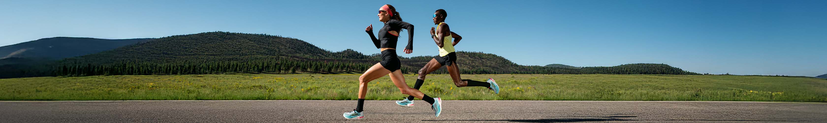 Shop Race & lightweight running shoes. Two people running in Hoka running shoes