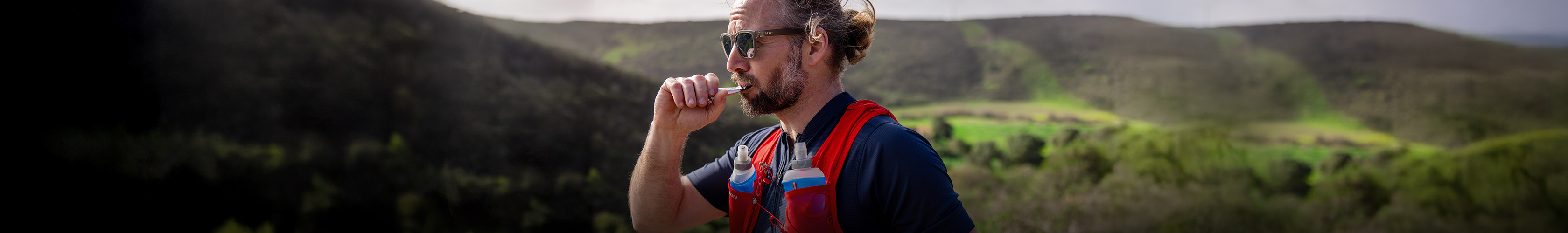 Shop Nutrition & hydration. A man in a blue T-shirt enjoying gel pack