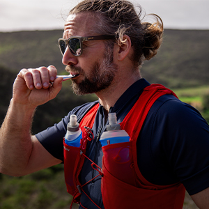 Shop Nutrition & hydration. A man in a blue T-shirt enjoying gel pack