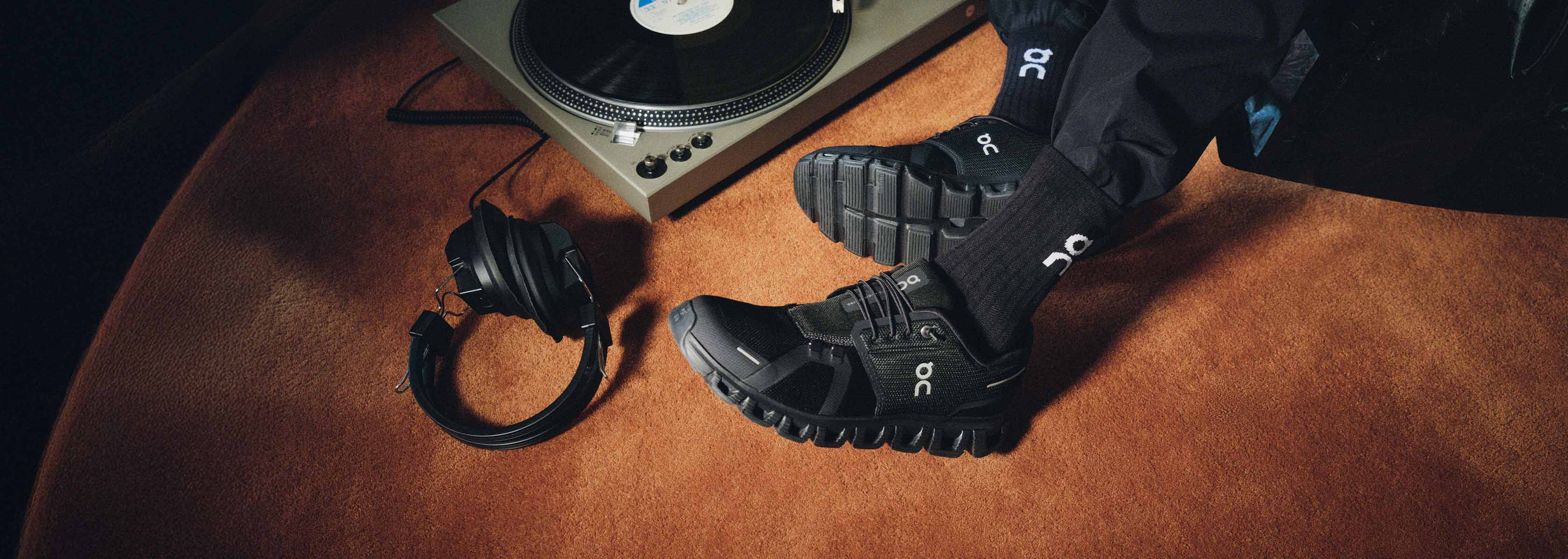 Shop Hoka Clifton. A group of runners on the street