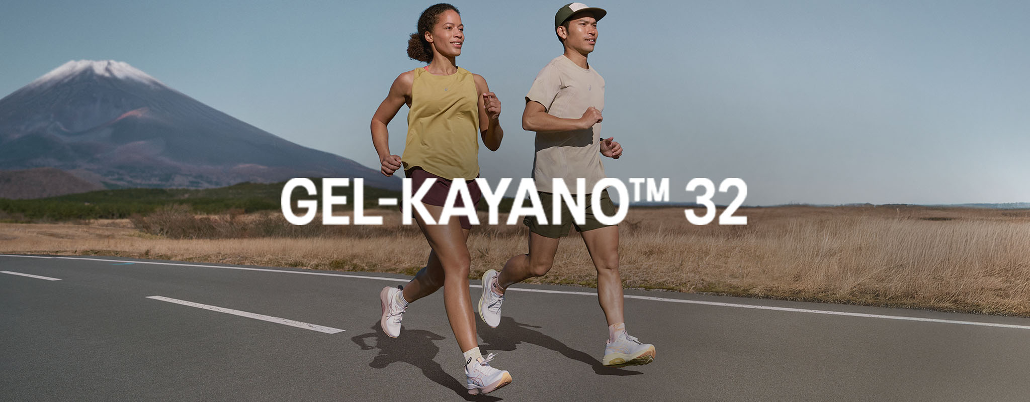 Shop Gel Kayano 32. Two runners running on the road