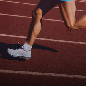 Shop running shoes. A close-up of running shoes on runners feet