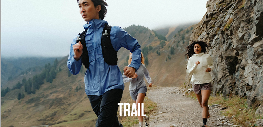 Shop marathon essentials. Man running in a yellow top