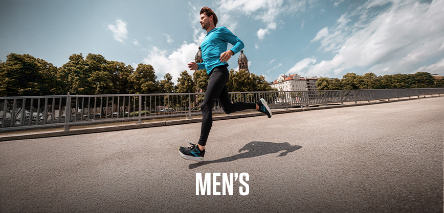 Shop Men's sale. A man in a blue T-shirt running on the street