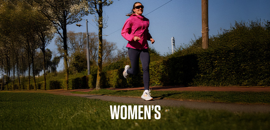 Shop women's. Women in pink jacket running on the street