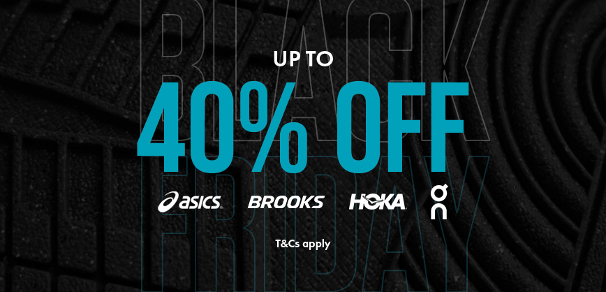 Shop Men's sale. A man in a blue T-shirt running on the street