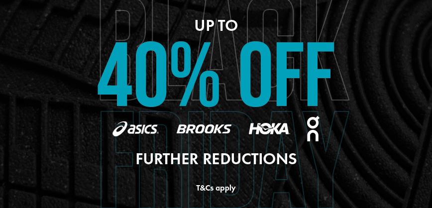 Shop Men's sale. A man in a blue T-shirt running on the street