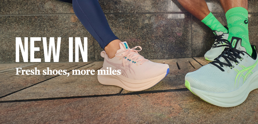 Shop Men's sale. A man in a blue T-shirt running on the street