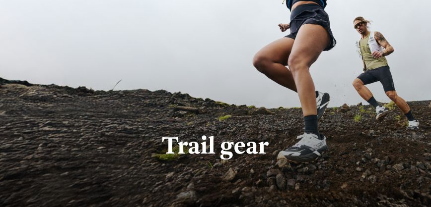 Shop marathon essentials. Man running in a yellow top