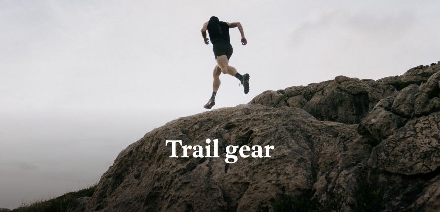 Shop marathon essentials. Man running in a yellow top