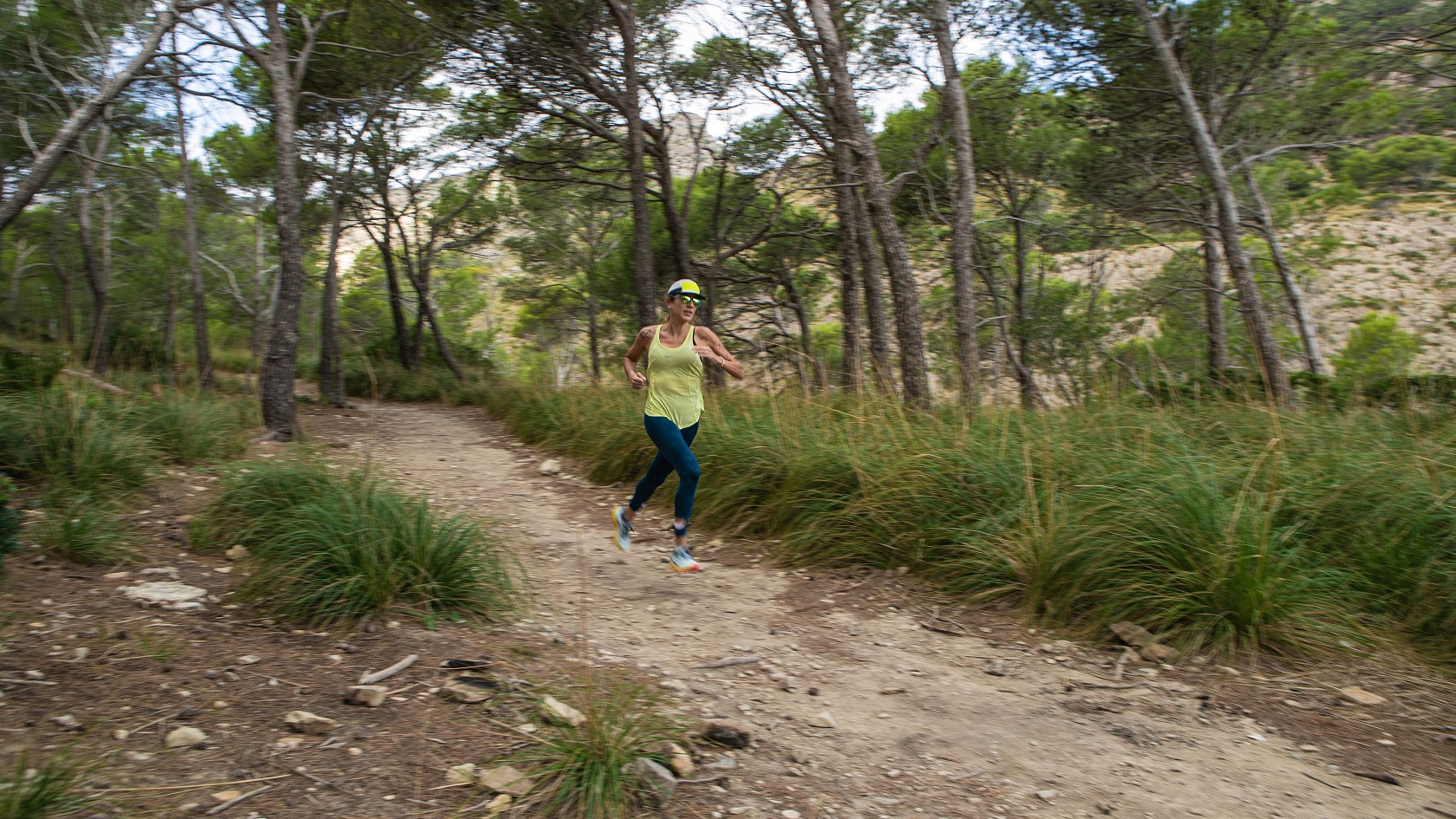 A trail runner on a forest path 